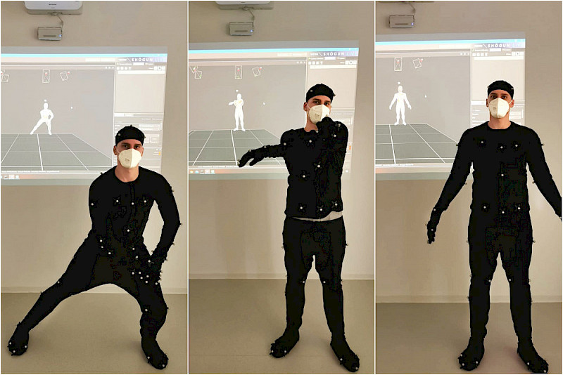 Alexander Linde demonstriert Bewegungsabläufe in einem Anzug mit sensorischen Punkten. Sie werden dann auf dem Monitor hinter ihm dargestellt.